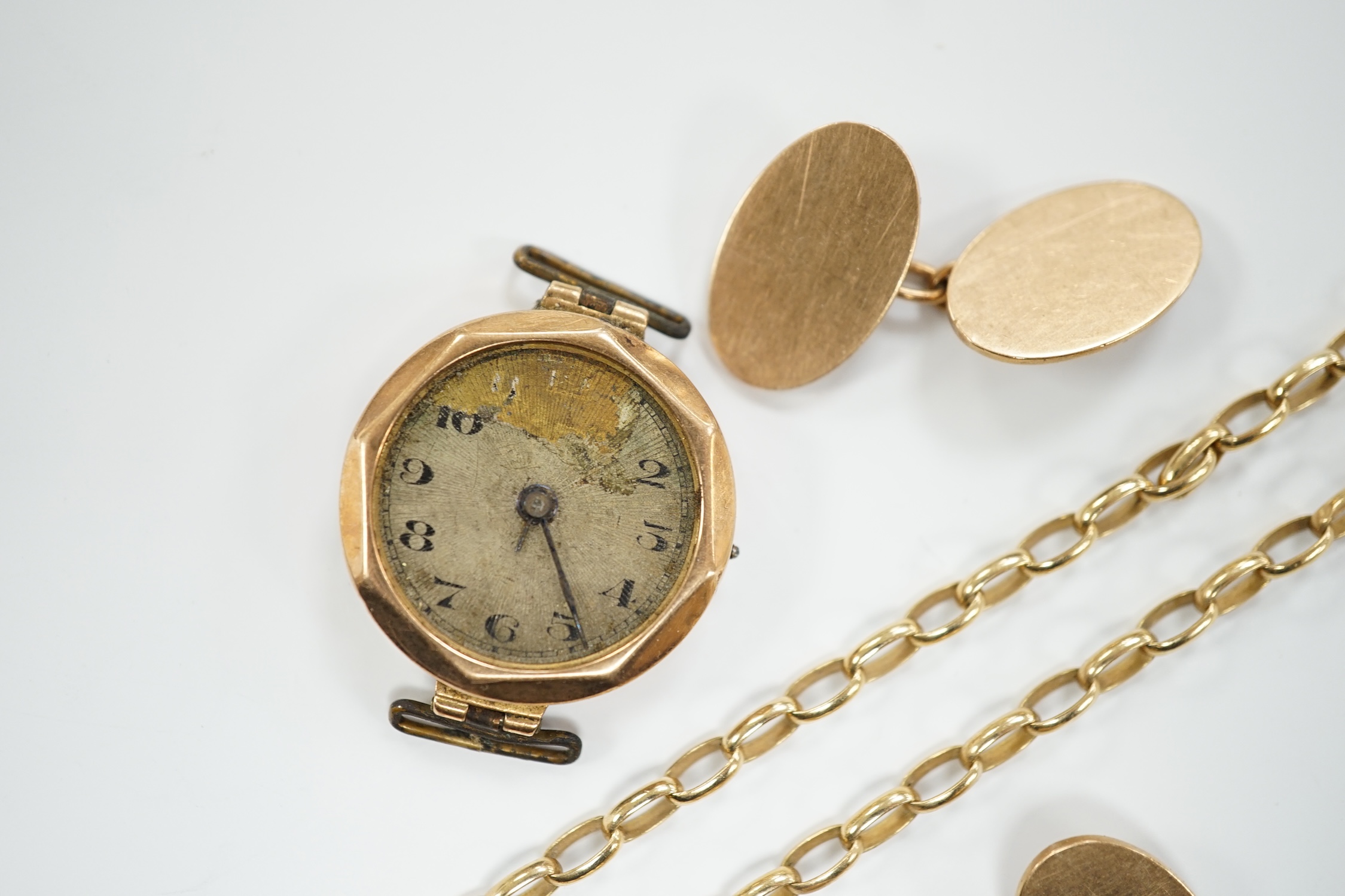 A pair of 9ct gold oval cufflinks, a modern 9ct gold chain, 12.2 grams and a 9ct gold wrist watch (a.f.).